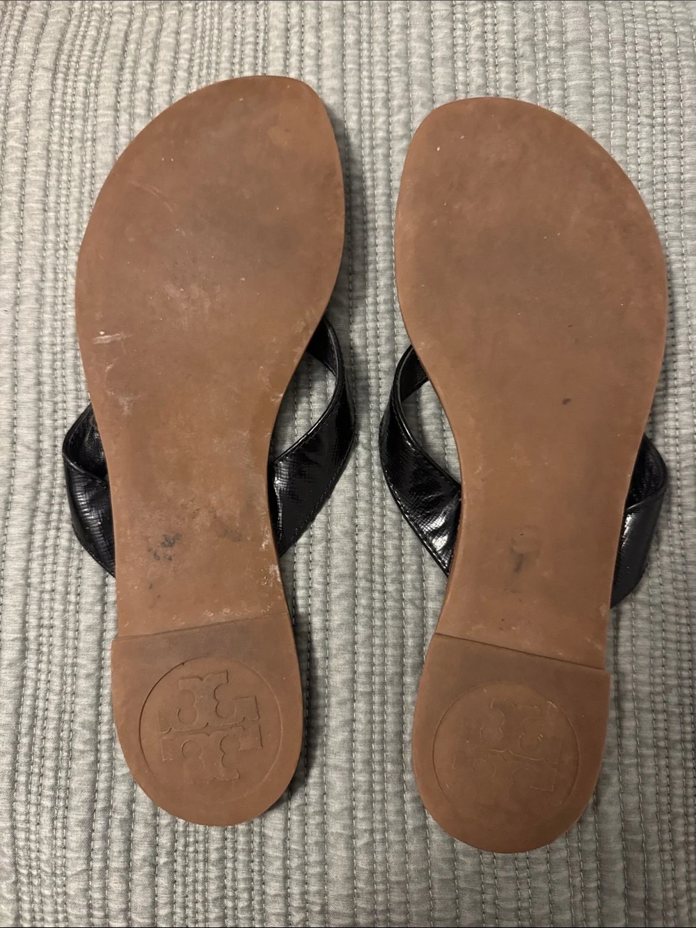 Tory Burch Black Leather Flip Sandals with Gold Logo Medallion